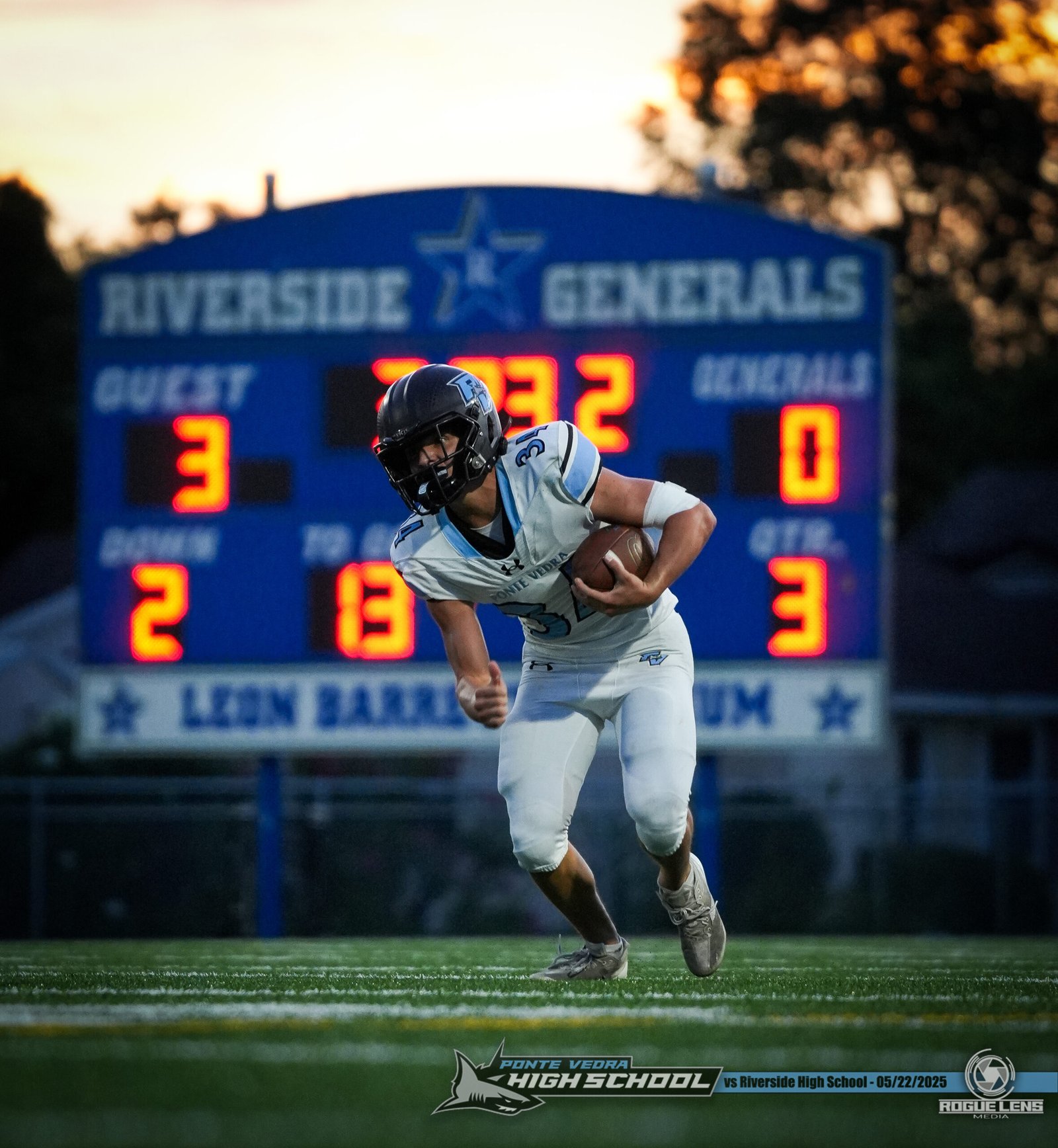 Running back in front of scoreboard